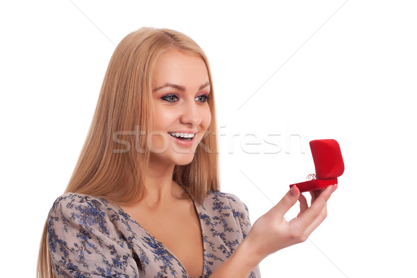 Woman looking at engagement ring in a box Stock photo © vankad