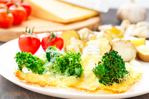 Broccoli gratin with cheese and baked potato Stock photo © vankad