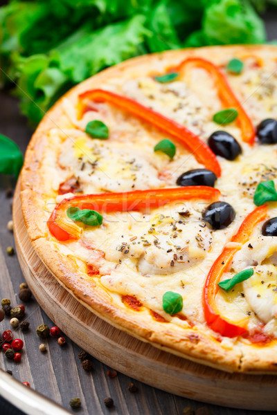 Pizza with chicken, pepper and olives Stock photo © vankad