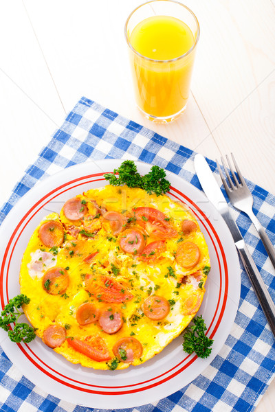 Omelette with slices of sausage and tomato Stock photo © vankad