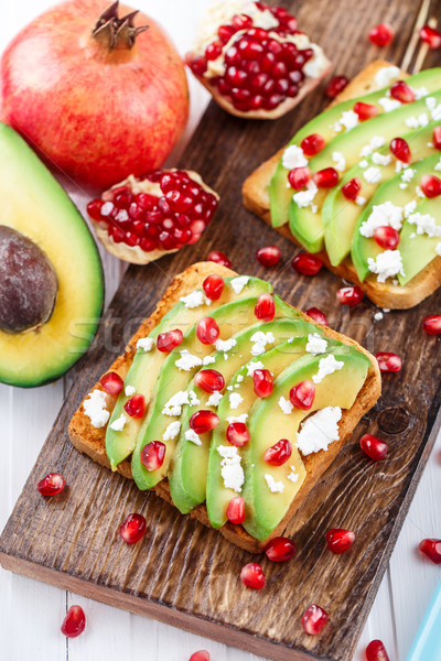 Avocado sandwich with feta and pomegranate Stock photo © vankad