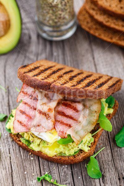 Sandwich with avocado and poached egg Stock photo © vankad