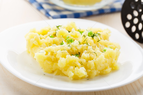 Mashed potatoes sprinkled with scallion and dill Stock photo © vankad