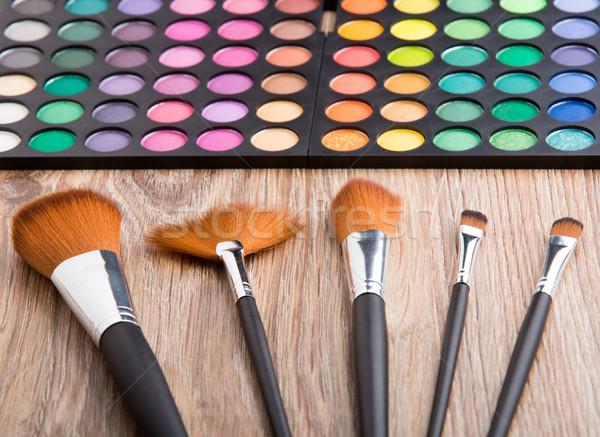 Makeup brushes and eye shadows Stock photo © vankad