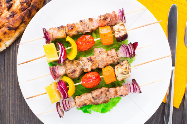 Barbecued pork and vegetable kebabs Stock photo © vankad