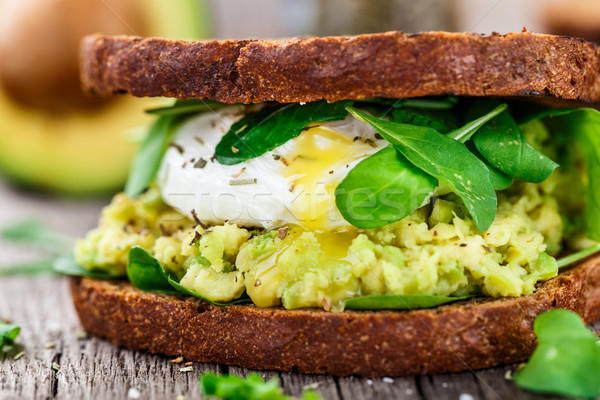 Sandwich with avocado and poached egg Stock photo © vankad