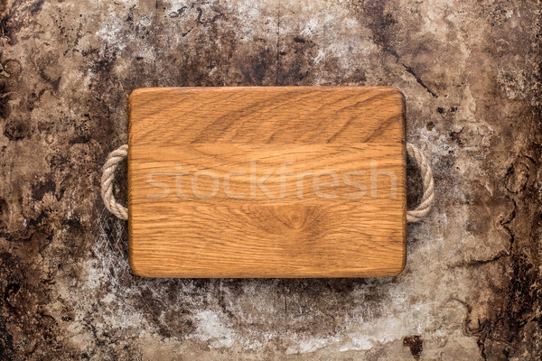 Chopping board on rustic table Stock photo © vankad