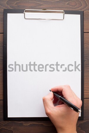 Stock photo: Somebody writing on a clean paper