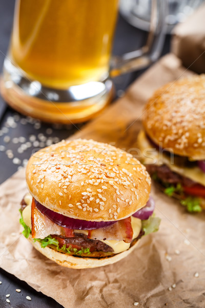 Delicious burger on wooden board Stock photo © vankad