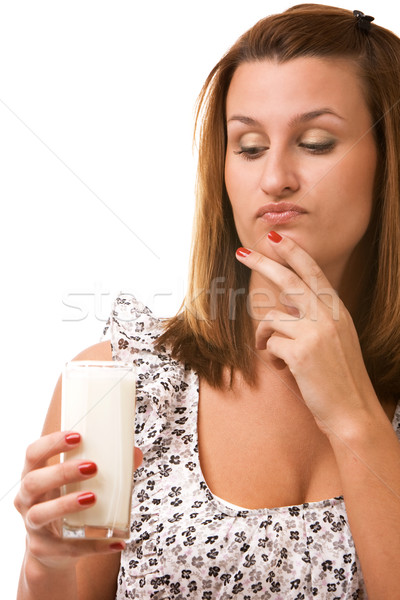 Young woman holding glass of milk Stock photo © vankad