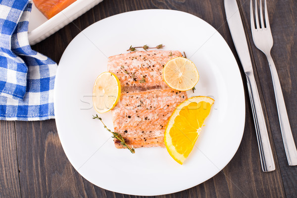 Salmon fillet with citrus and thyme Stock photo © vankad
