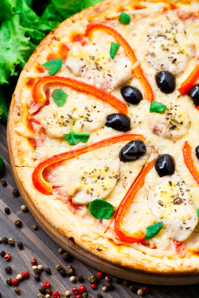 Pizza with chicken, pepper and olives Stock photo © vankad