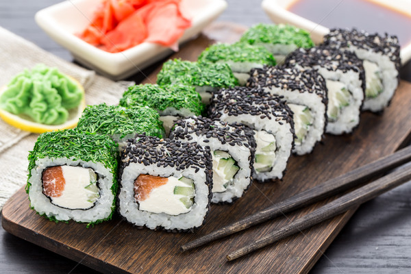 Stock photo: Sushi roll covered with dill and sesame