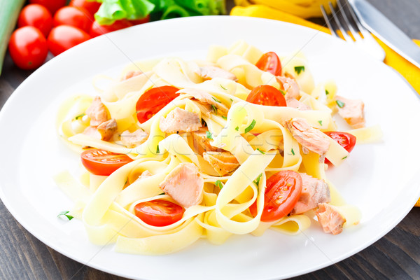 Delicious fettuccini with salmon and tomatoes Stock photo © vankad
