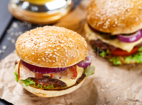 Delicious burger on wooden board Stock photo © vankad