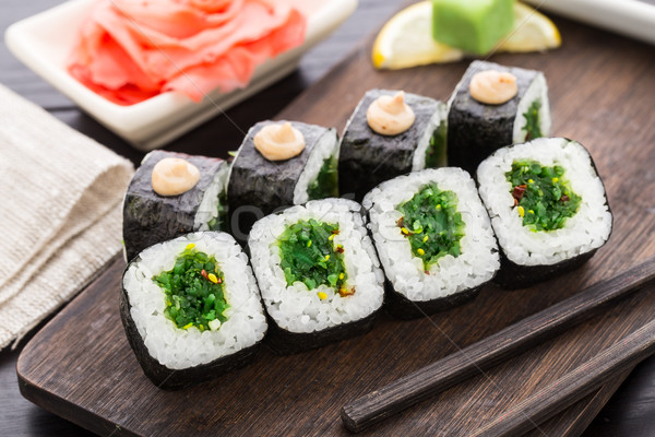 Sushi rolls with chuka salad Stock photo © vankad