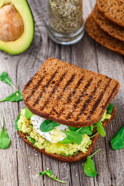 Sandwich with avocado and poached egg Stock photo © vankad