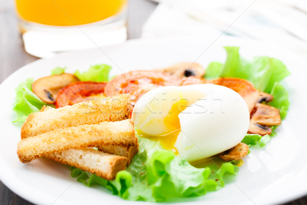 Light breakfast with soft egg, tomato and croutons Stock photo © vankad