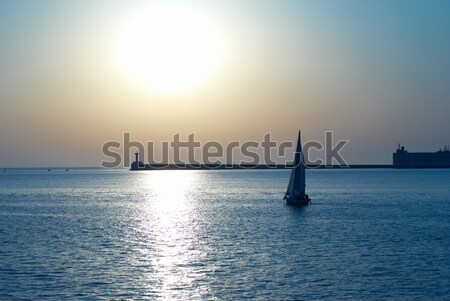 Vela barca tramonto mare blu marine Foto d'archivio © vapi