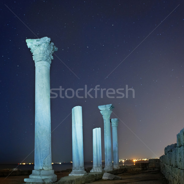 Ruins of ancient city columns under night sky Stock photo © vapi