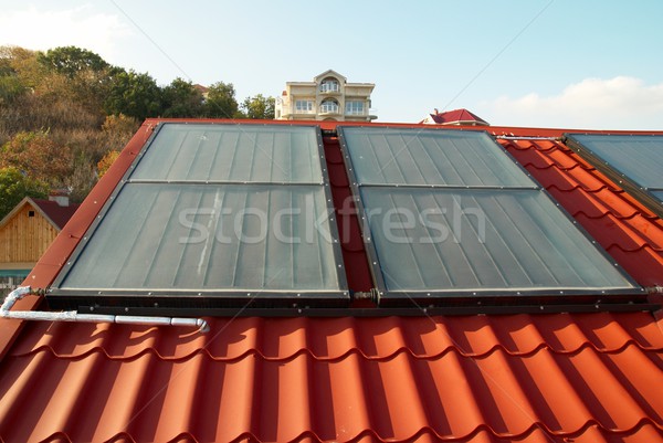 Alternative energy- solar system on the house roof. Stock photo © vapi