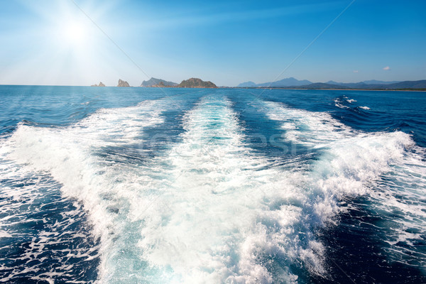 Waves on blue sea behind the boat  Stock photo © vapi