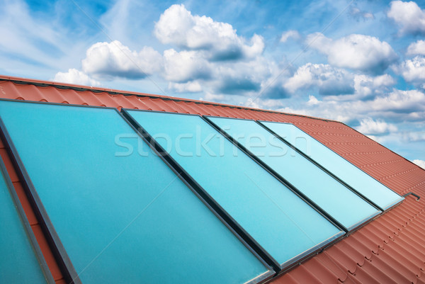 Solar cells on the red house roof Stock photo © vapi