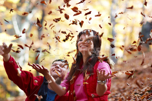 Young couple enjoying the falling leaves Stock photo © vapi