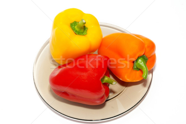 Trzy kolorowy papryka tablicy biały jedzenie Zdjęcia stock © vapi