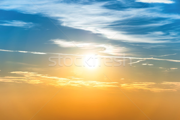 Sunset in the sky with blue orange clouds Stock photo © vapi