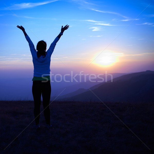 Silhouette jeune femme coucher du soleil ciel bleu ciel fille [[stock_photo]] © vapi