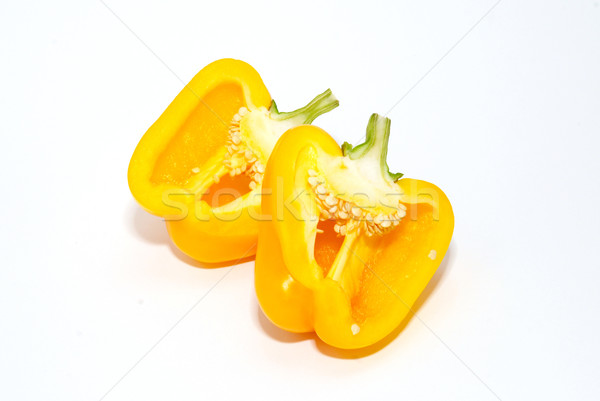 Two halves of slitting yellow paprika isolated on white. Stock photo © vapi