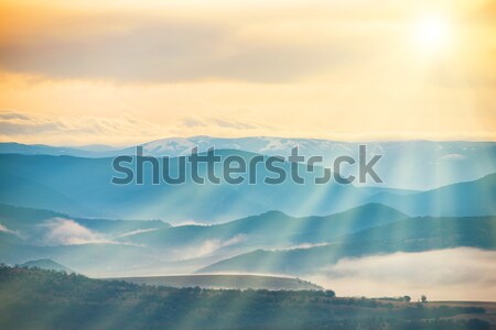 Blue mountains covered with mist  Stock photo © vapi