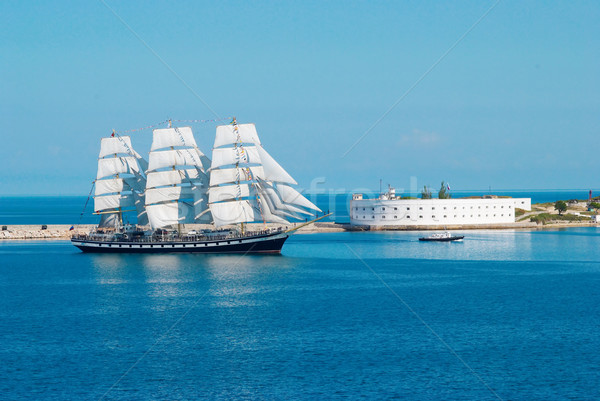 Sailing ship entering to the bay. Stock photo © vapi