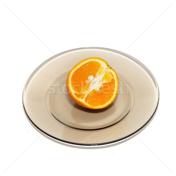 Orange segments on the plate isolated on white. Stock photo © vapi