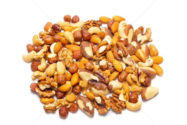 Stock photo: Heap many kinds of hazelnuts isolated on white.