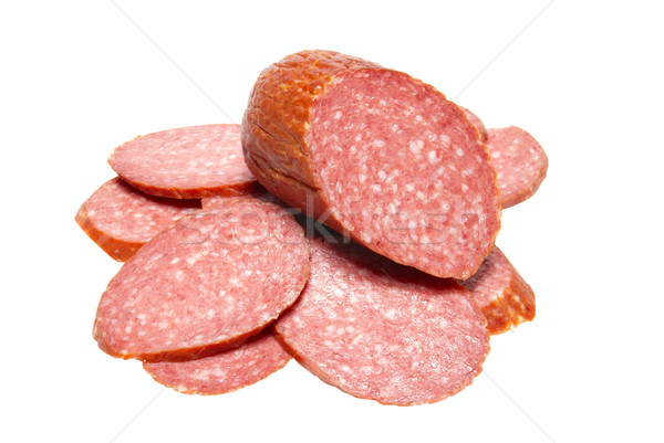 Bits of summer sausage isolated on white. Stock photo © vapi