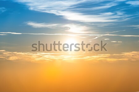 Sunset in the sky with blue orange clouds Stock photo © vapi