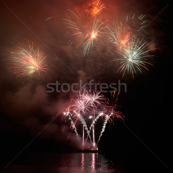 Színes ünnep tűzijáték fekete égbolt boldog Stock fotó © vapi