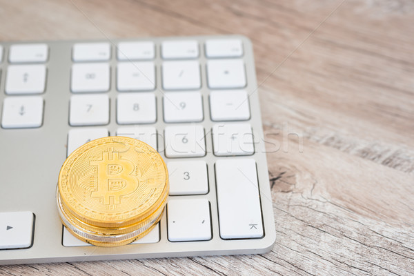 Golden bitcoin on a keyboard  Stock photo © vapi