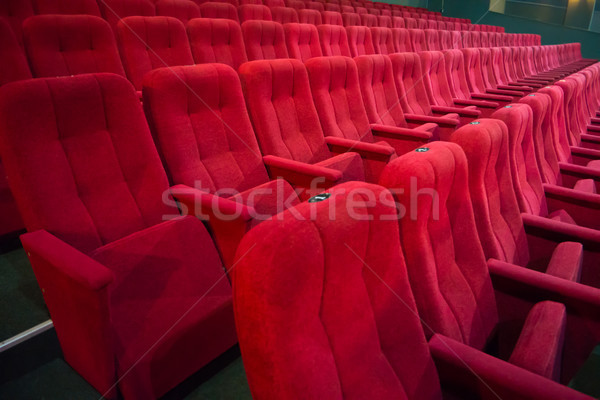 Aisle with rows of red seats Stock photo © vapi