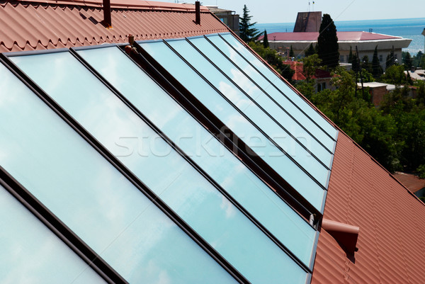 Solar panels (geliosystem) on the house roof. Stock photo © vapi