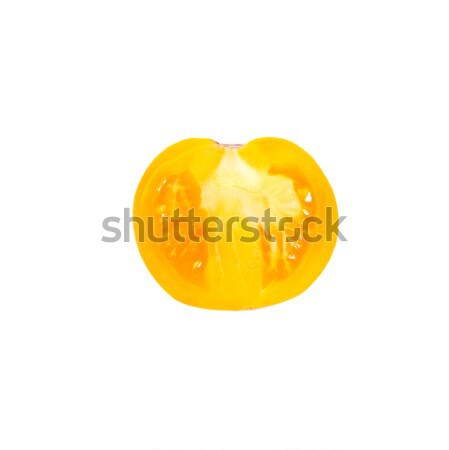 A half of fresh yellow tomato isolated on white. Stock photo © vapi