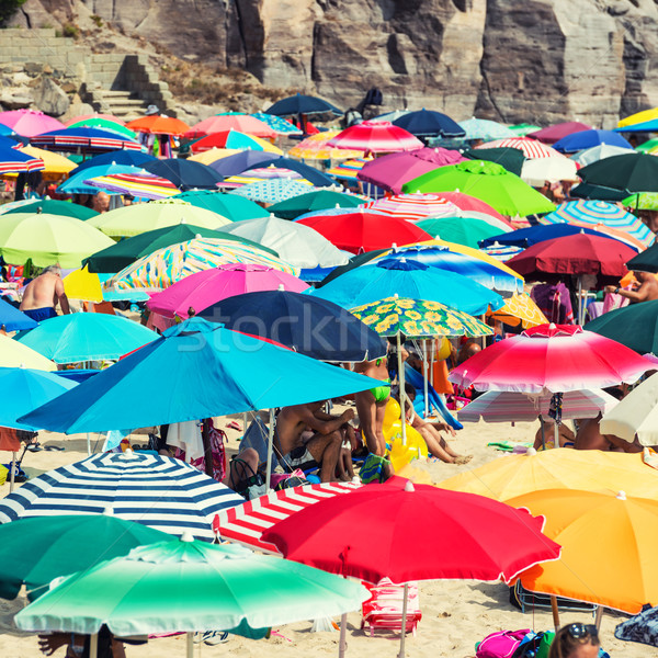 Muchos colorido paraguas playa de arena sol naturaleza Foto stock © vapi