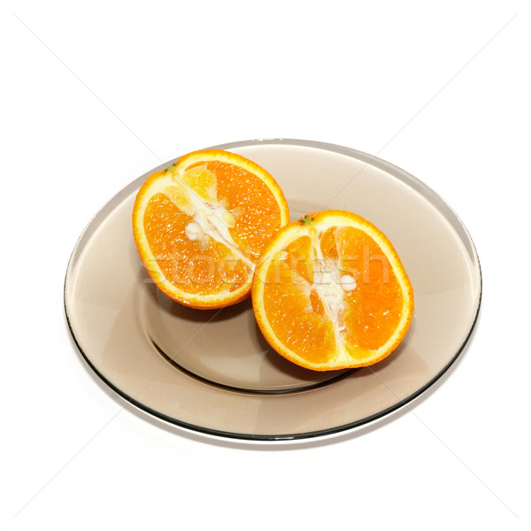 Orange segments on the plate isolated on white. Stock photo © vapi