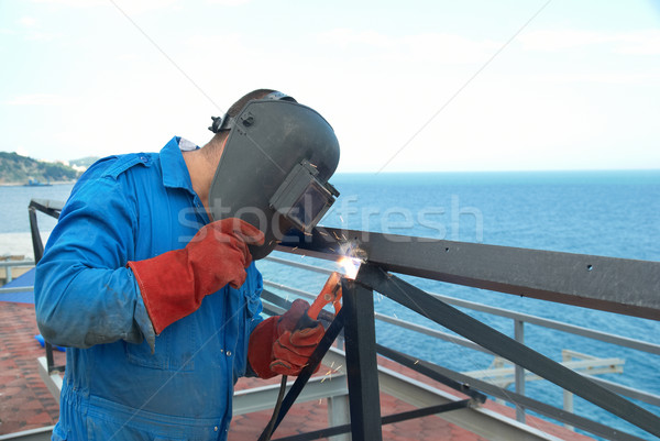 Welder working with metal construction Stock photo © vapi