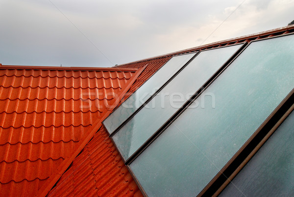 Solar panel (geliosystem) on the house roof. Stock photo © vapi