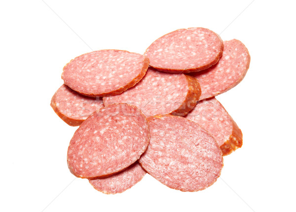 Bits of summer sausage isolated on white. Stock photo © vapi