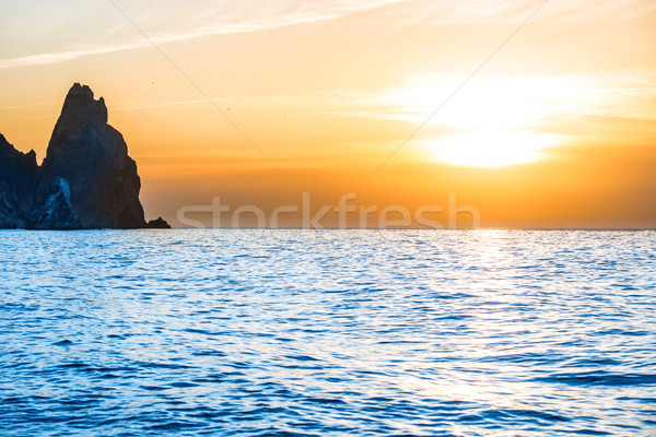 Sunset above the blue sea Stock photo © vapi