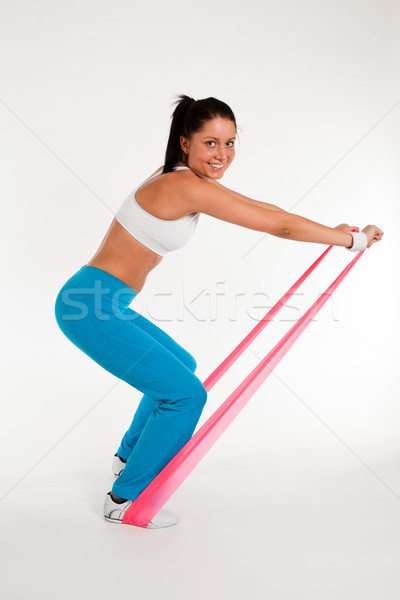 woman exercising with rubber ribbon Stock photo © varlyte